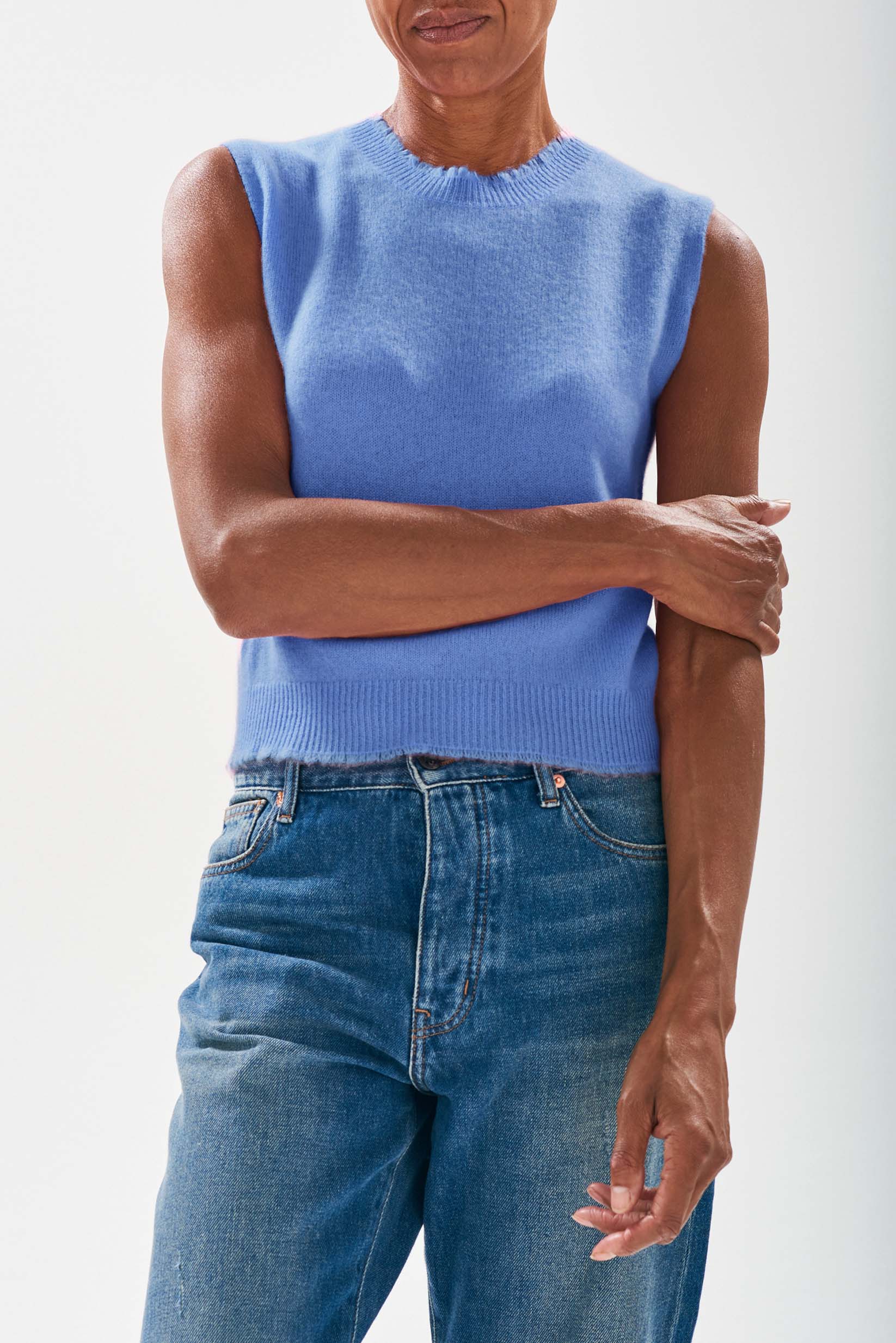 Model wearing Jumper1234 Cornflower blue cashmere crew neck tank with 'distressed' ribs