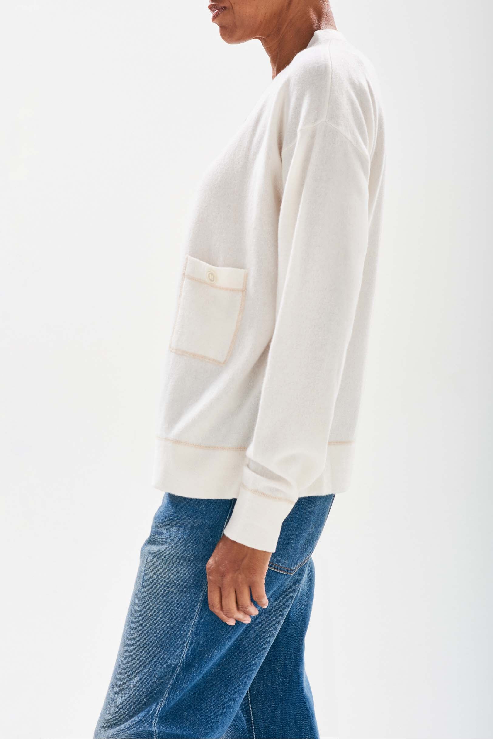 Jumper1234  Cream boyfriend vee neck cashmere cardigan with organic light brown top stitching detail and a pocket stood sideways 