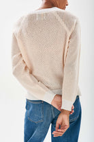 Model wearing Jumper1234 Mesh cashmere crew neck jumper in cream with contrast white ribs facing away from the camera