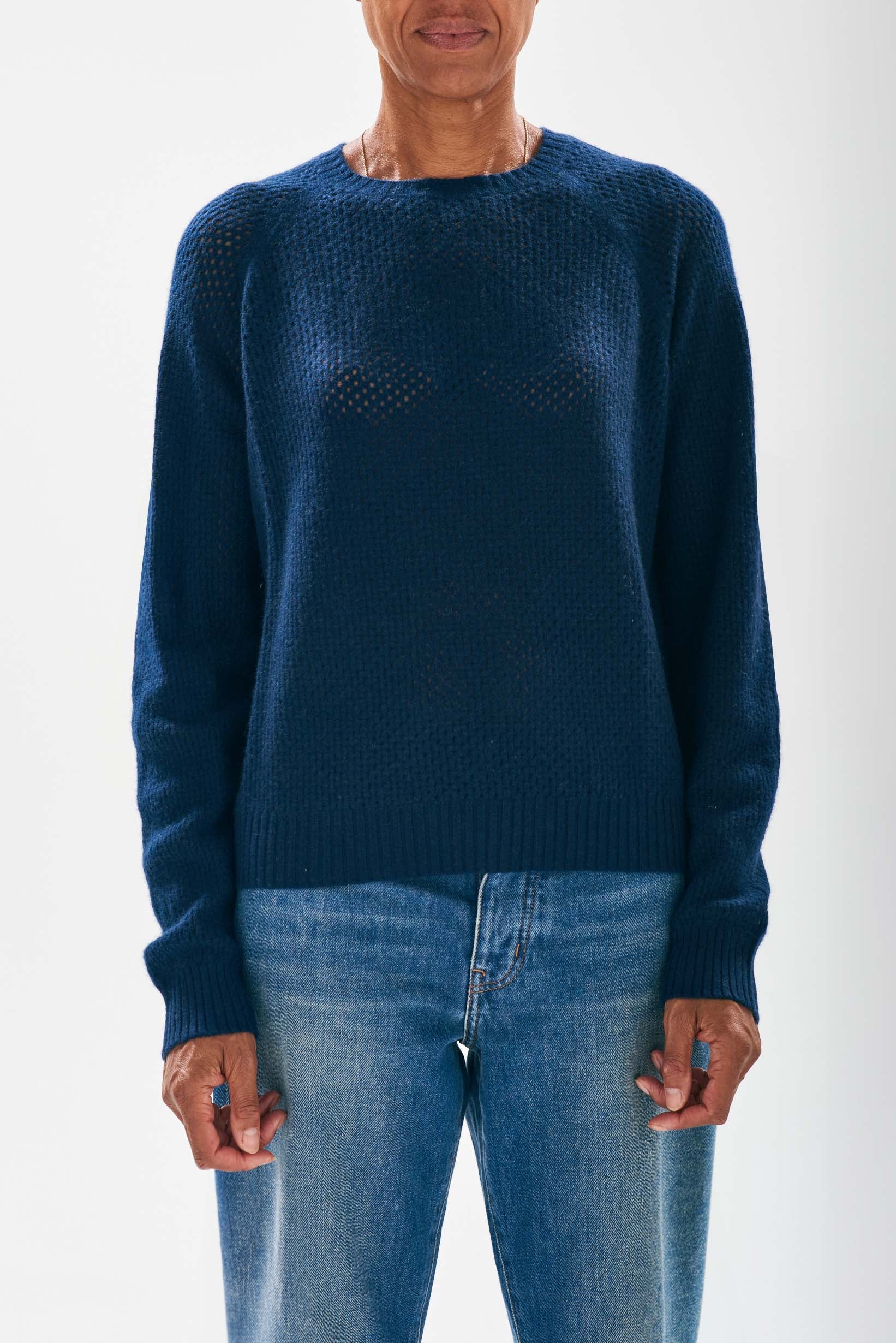 Model wearing Jumper1234 Mesh cashmere crew neck jumper in navy. 