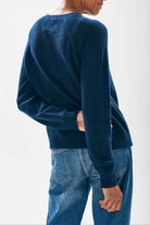 Model wearing Jumper1234 Mesh cashmere crew neck jumper in navy facing away from the camera.