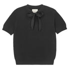 Jumper 1234 Black pointelle merino short sleeve jumper with a tie bow. 