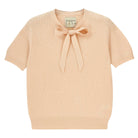 Jumper 1234 cream pointelle merino short sleeve jumper with a tie bow.