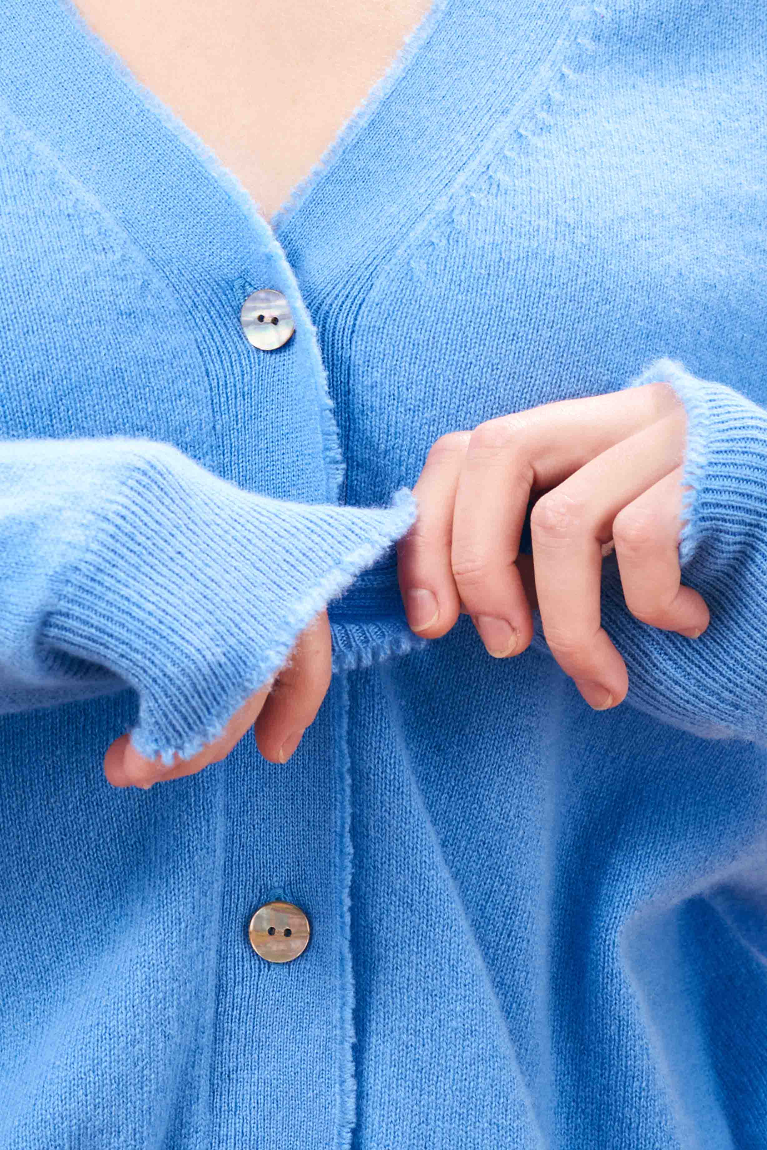 Jumper 1234 Blue cashmere vee neck cardigan with 'distressed' ribs close up