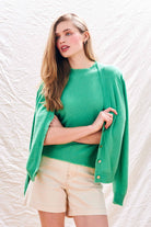 Blonde female model wearing Jumper 1234 Green cashmere vee neck cardigan with 'distressed' ribs and matching t-shirt