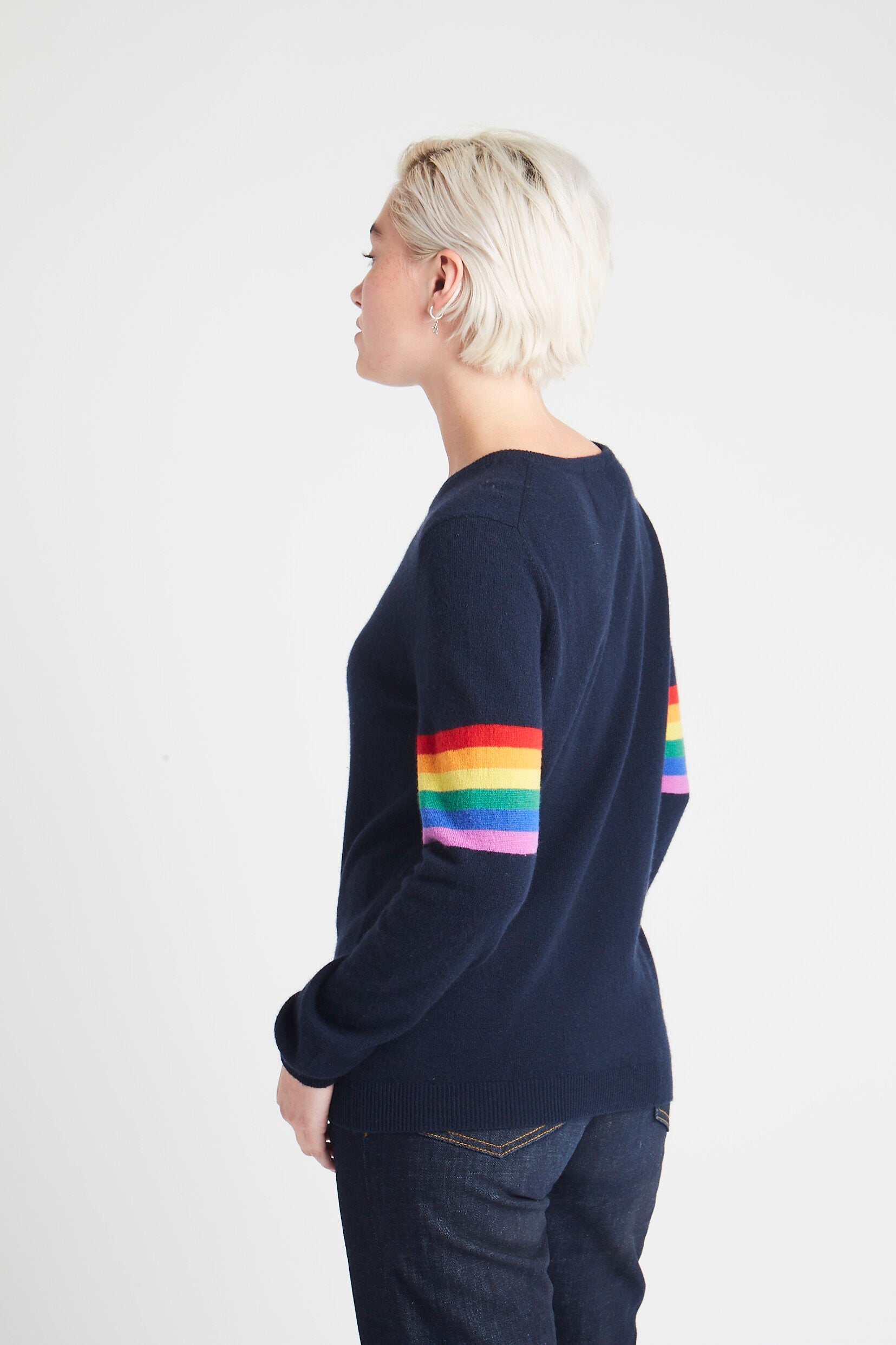 Blonde female model facing away from camera wearing Jumper1234 Rainbow Stripe Sleeve Cashmere Sleeve in Navy